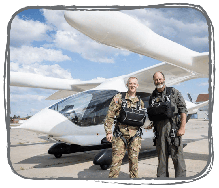 Two people stand in front of ALIA