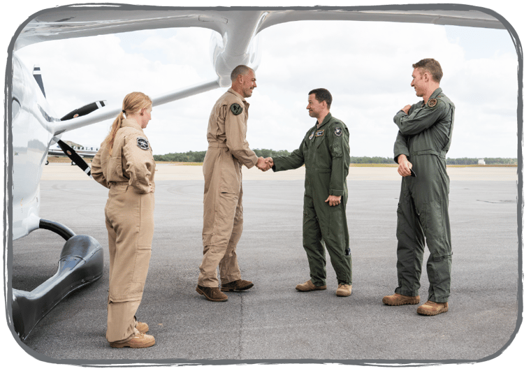 Kyle shaking the hand of a member of the DOD