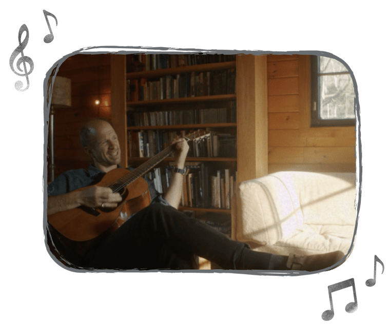 An image of Ryan Ober playing the guitar